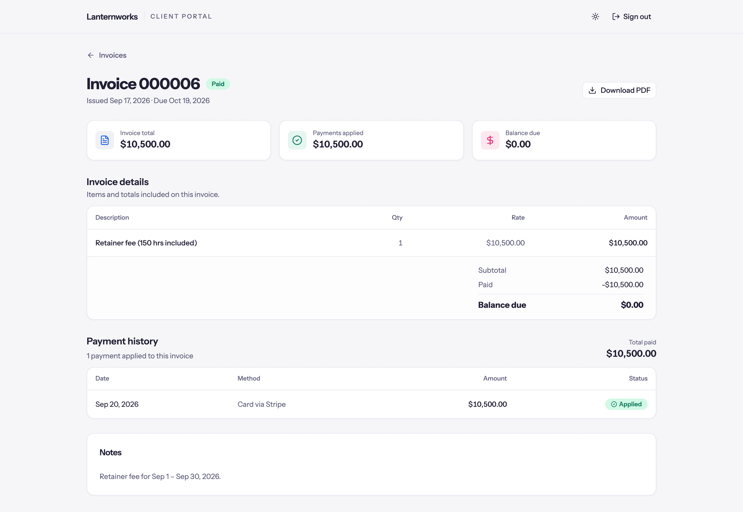 A paid retainer invoice in the client portal: total, payments applied, zero balance, and a card payment through Stripe in the payment history